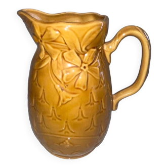 Old pitcher decorated with flowers