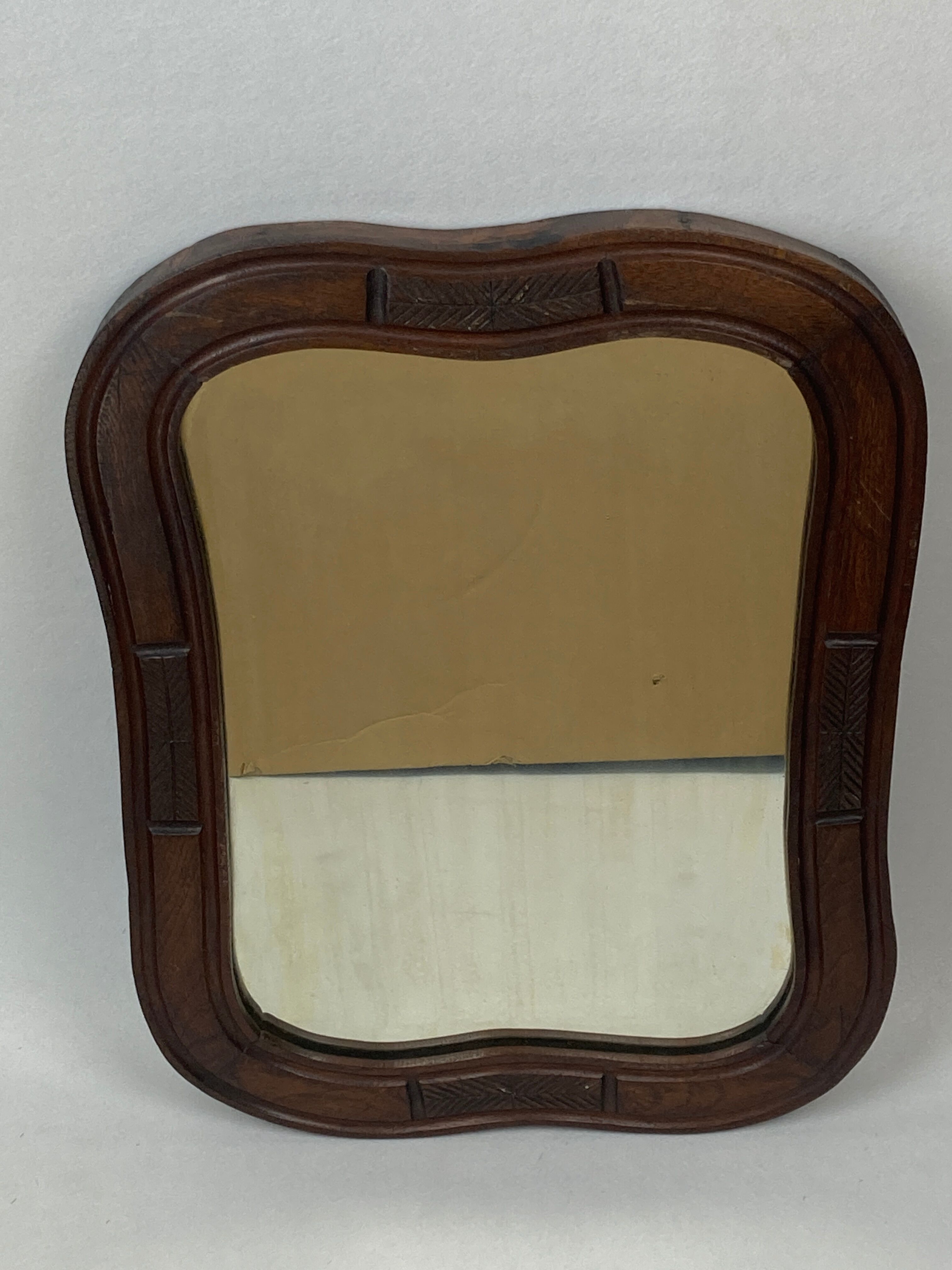 Hand carved wavy curvy vanity mirror, ca 1900