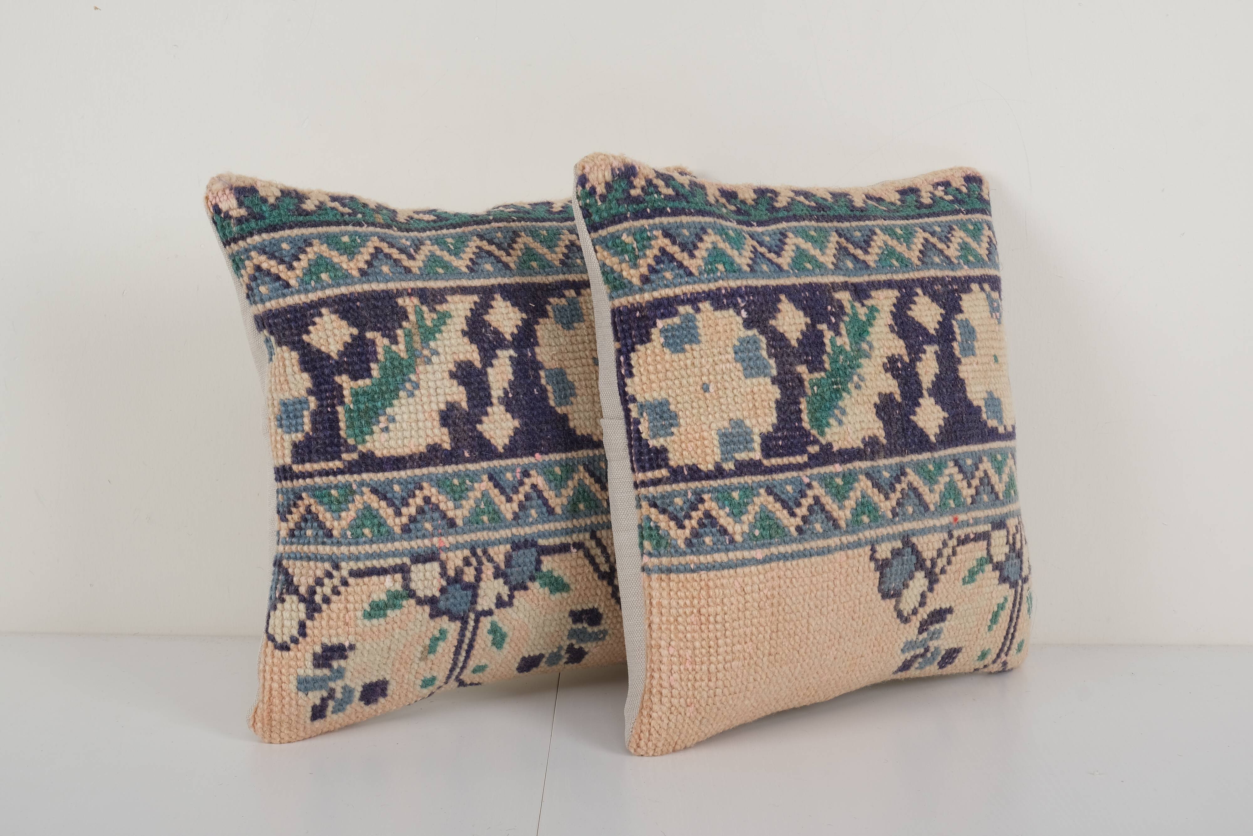 Set of two muted ecru carpet rug pillows