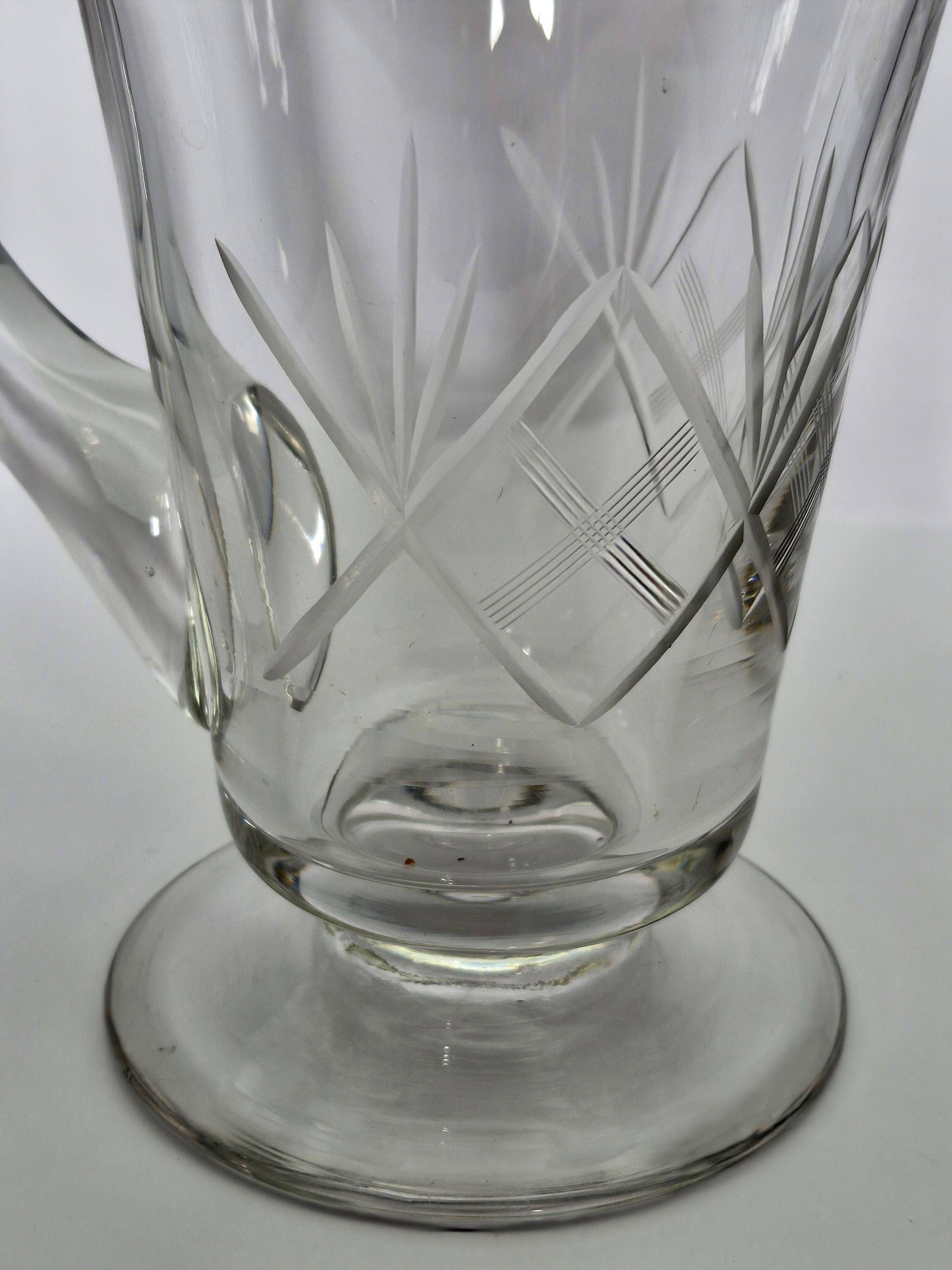 Crystal service from Fains, matching wine carafe and water jug.