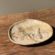Small beige oval petrified wood dish or tray with crystals.