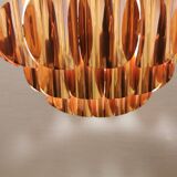 Copper colored hanging lamp. designed by thorsten orrling sweden