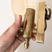 Pair of vintage shell glass wall lights, Art Deco style fixtures.