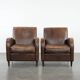 Elegant set of two sheepskin leather armchairs with beautiful round shapes