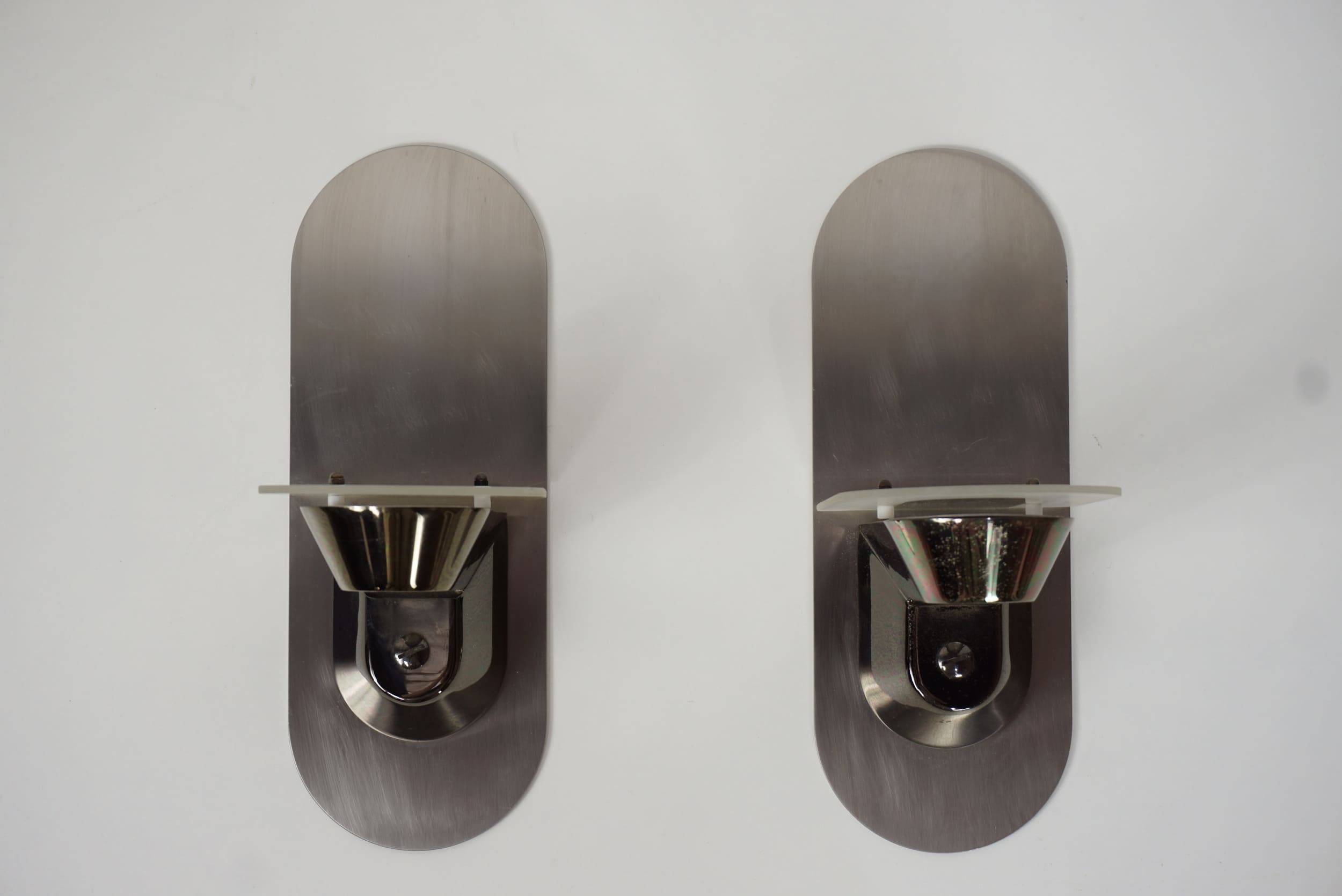 Pair of stainless steel and glass wall lamps