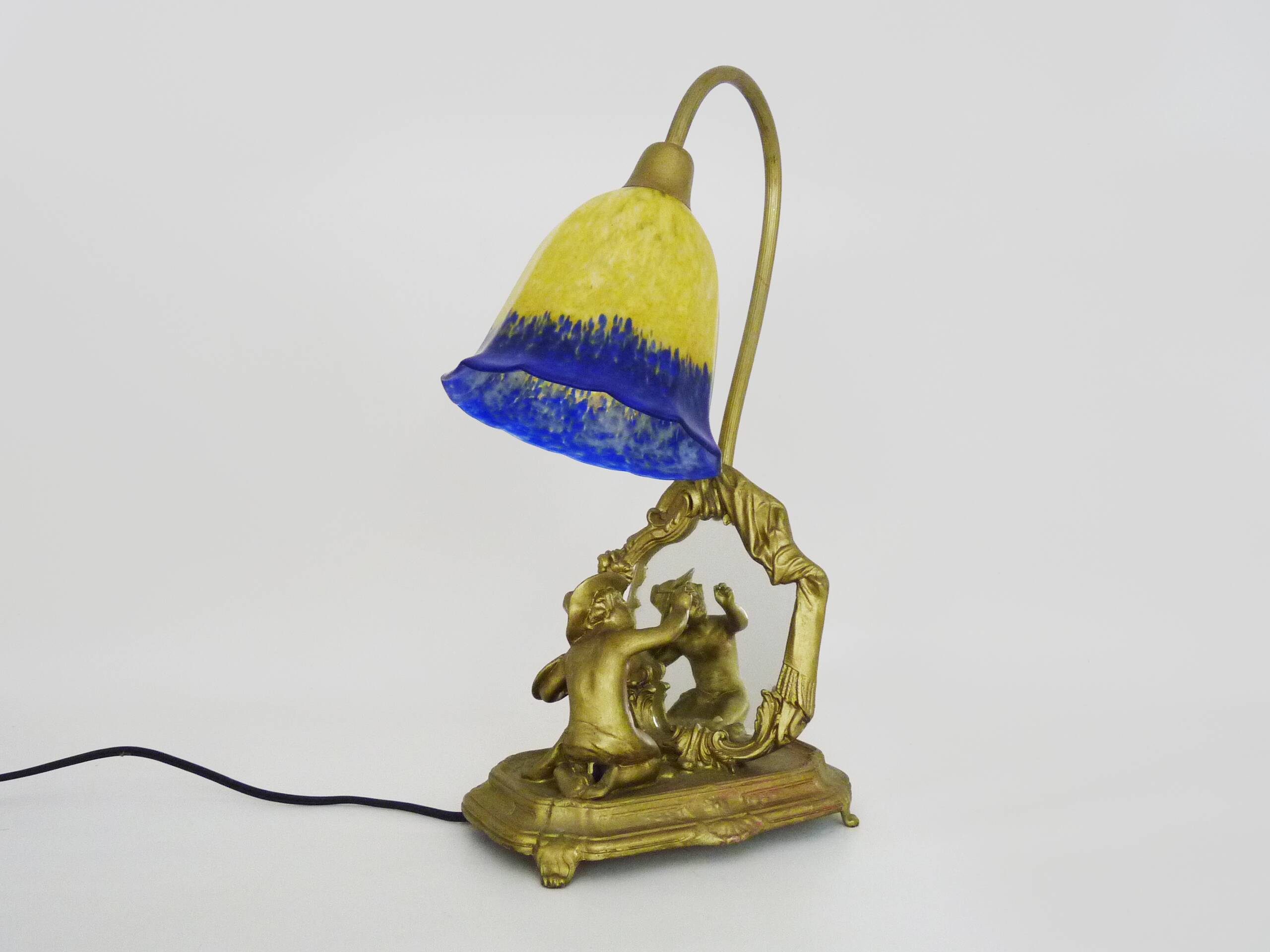 Vintage bronze table lamp featuring a painter on a mirror from the 1960s.