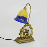 Vintage bronze table lamp featuring a painter on a mirror from the 1960s.