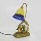 Vintage bronze table lamp featuring a painter on a mirror from the 1960s.