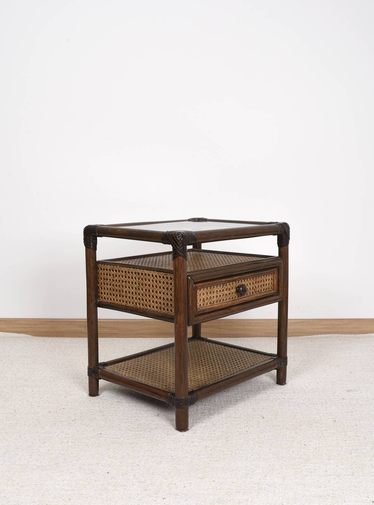 Rattan and cane bedside table, smoked glass top