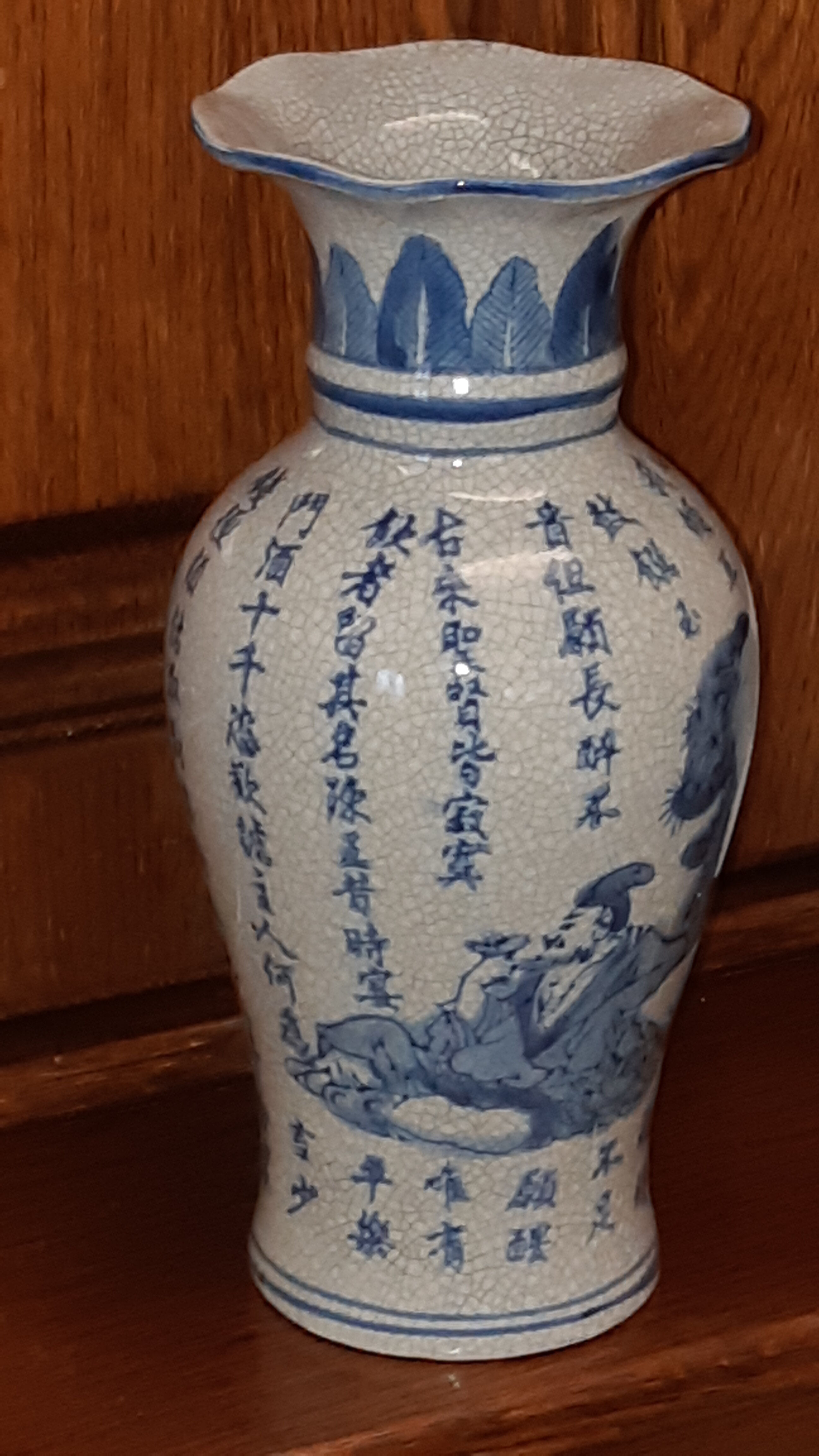 Ancient Chinese vase with blue decoration of sage and inscriptions