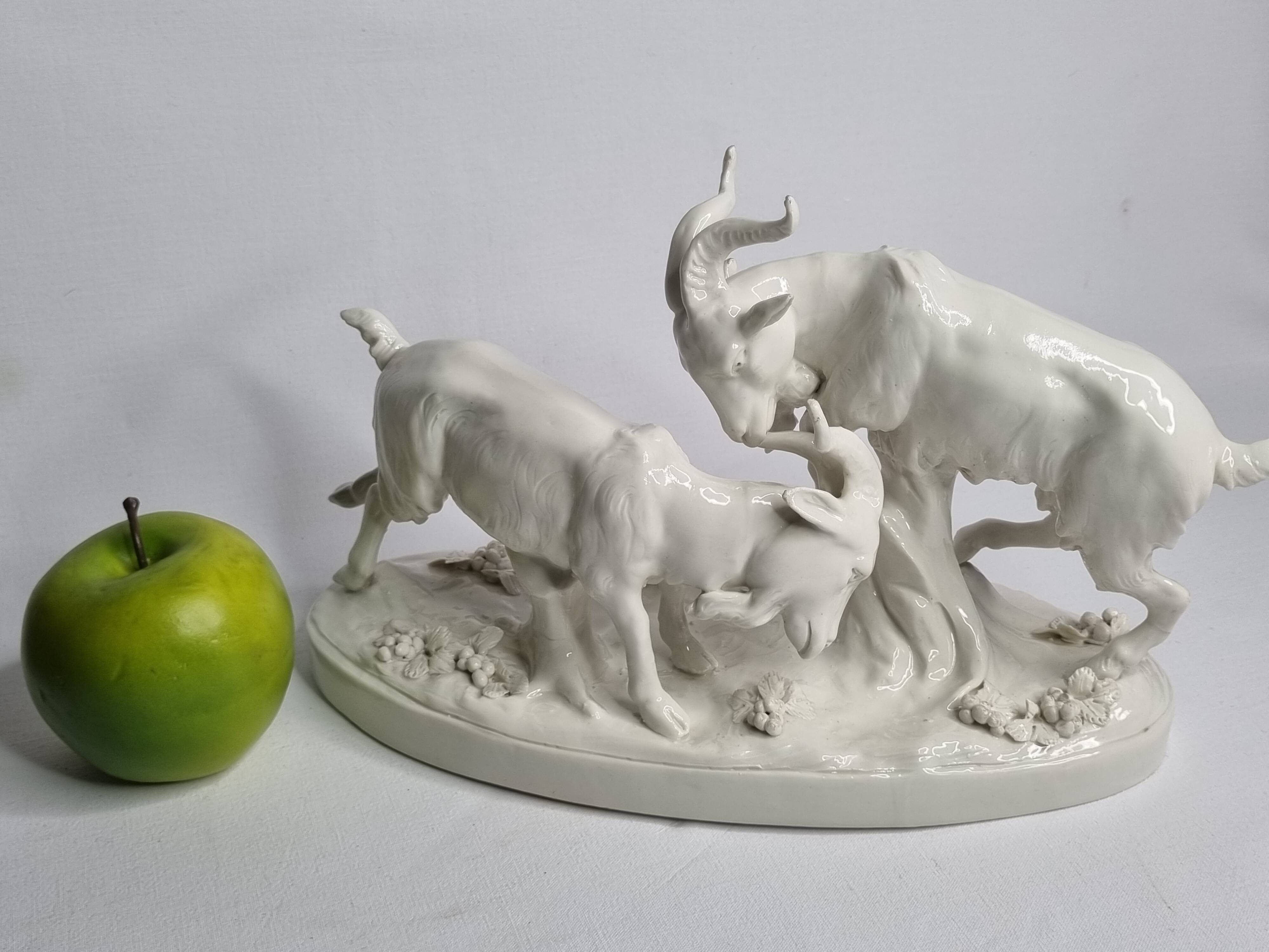 Saxon porcelain group, two fighting goats, signed Röhle, 1900