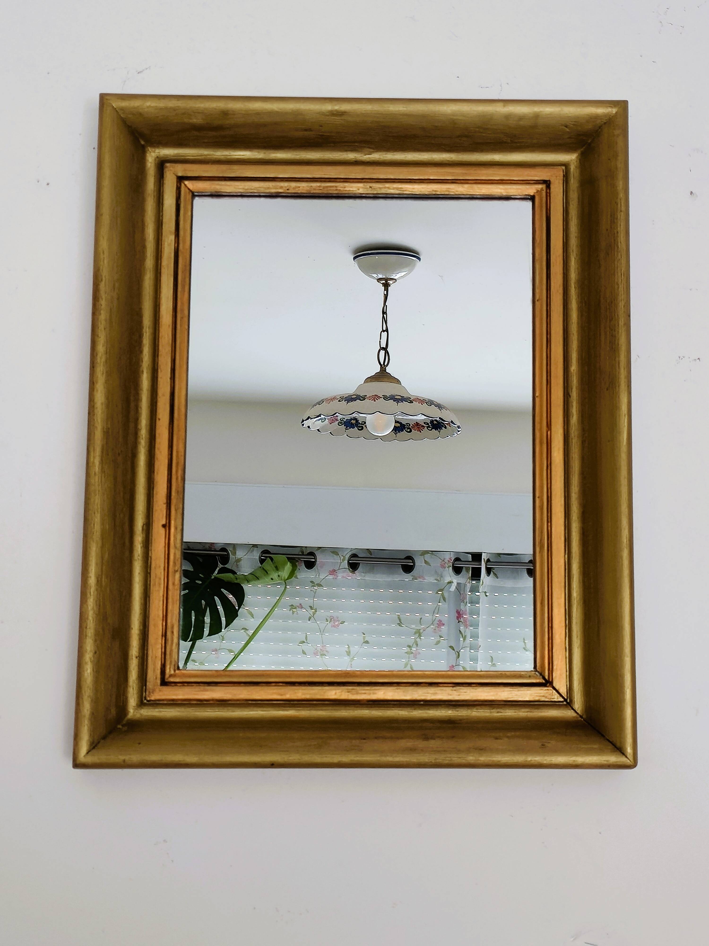 Antique mirror in gilded and copper wood