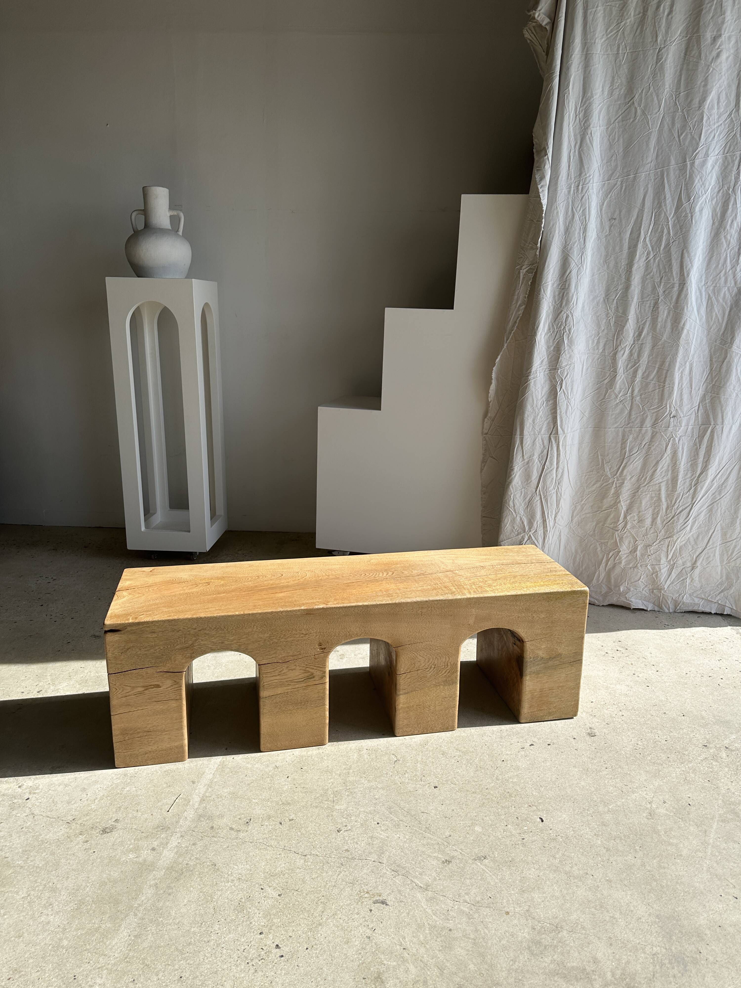 Solid monoxyl wood bench with carved 3-arch base - Natural wood color