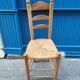 Neo-rustic chair in wood and wicker in the brutalist style by Charles Dudyoyut.