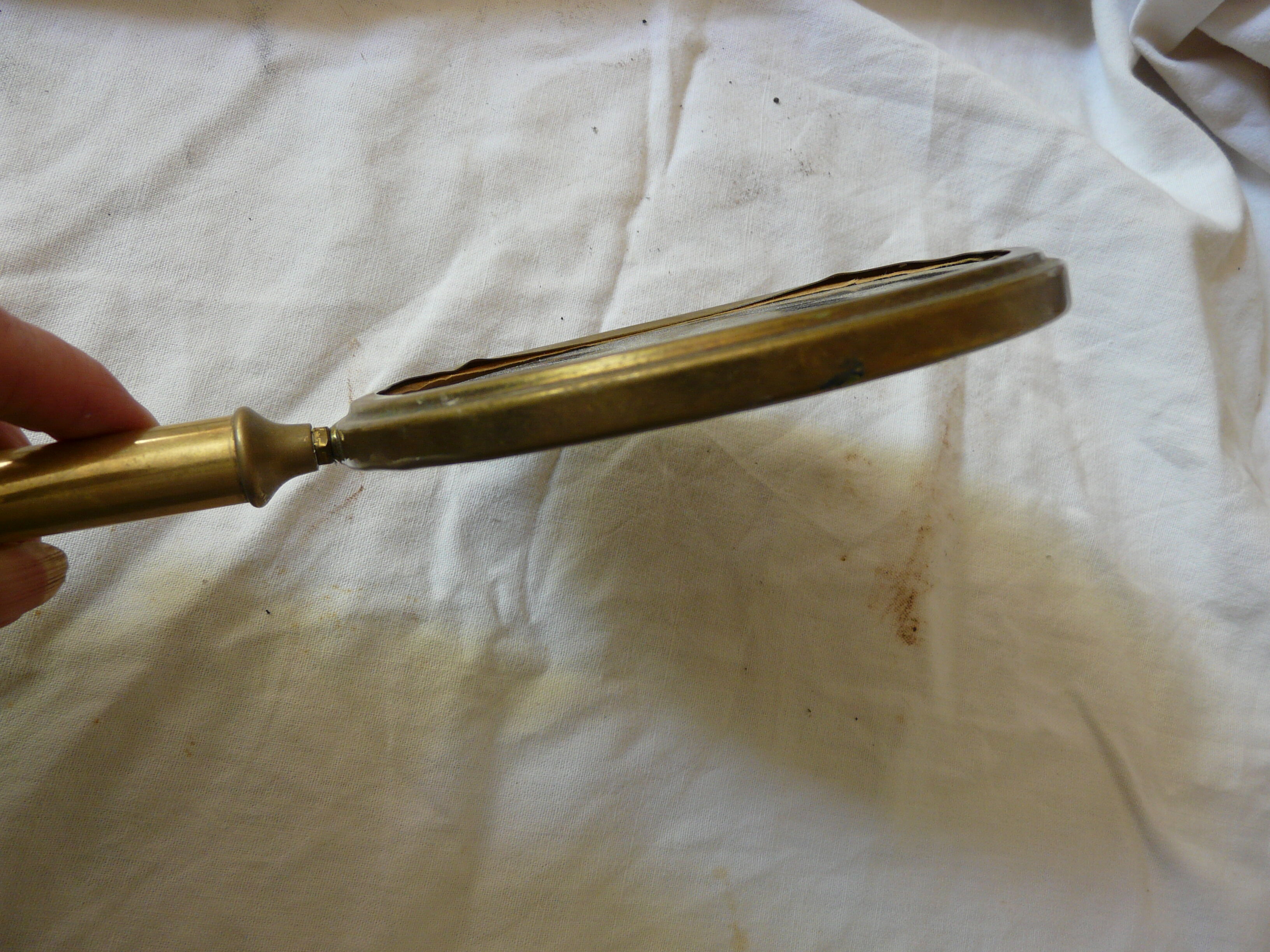 Art Deco era brass hand mirror