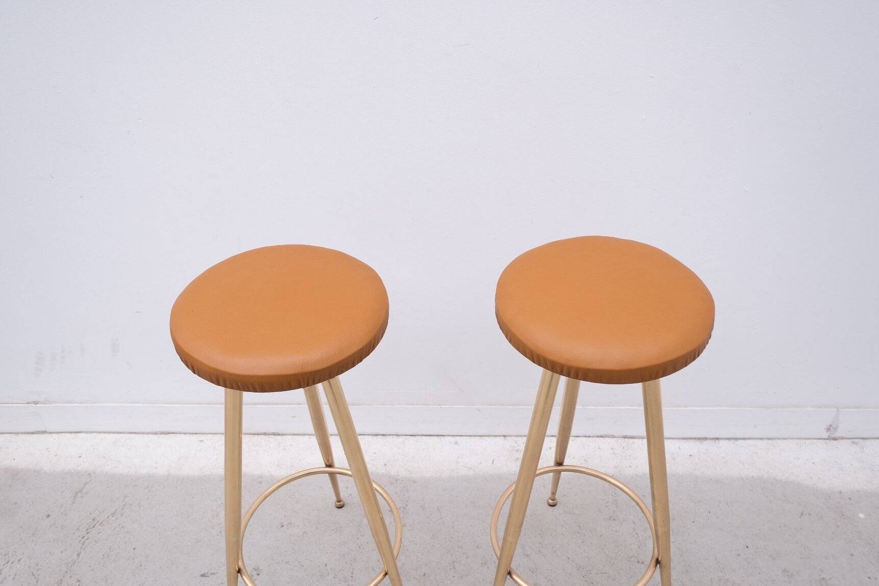 Pair of brass and leather stools, Italy 1960