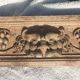 Carved wooden pediment with bunches of grapes