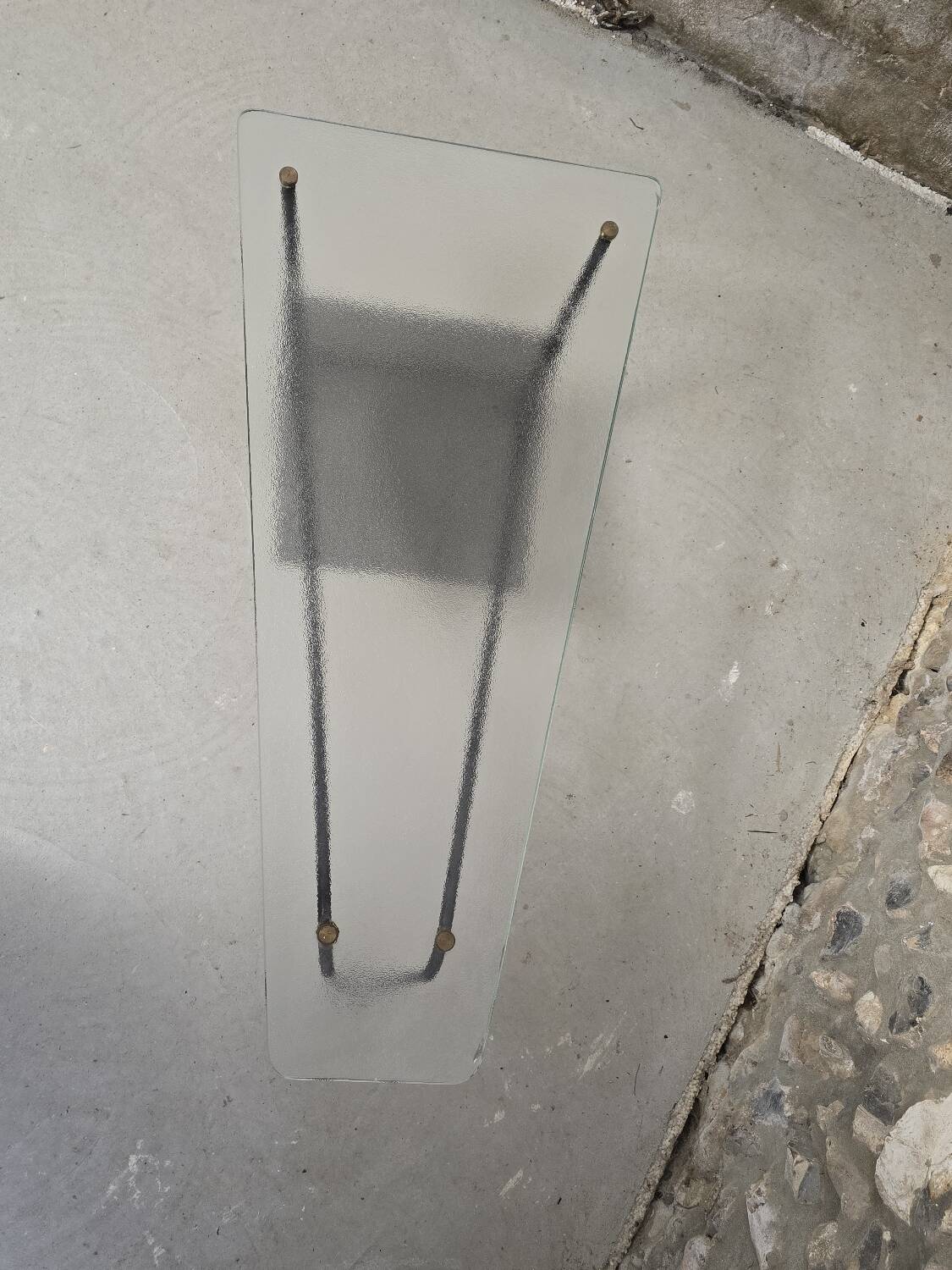 Coffee table in glass and black lacquered metal