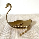 Empty brass swan pocket
