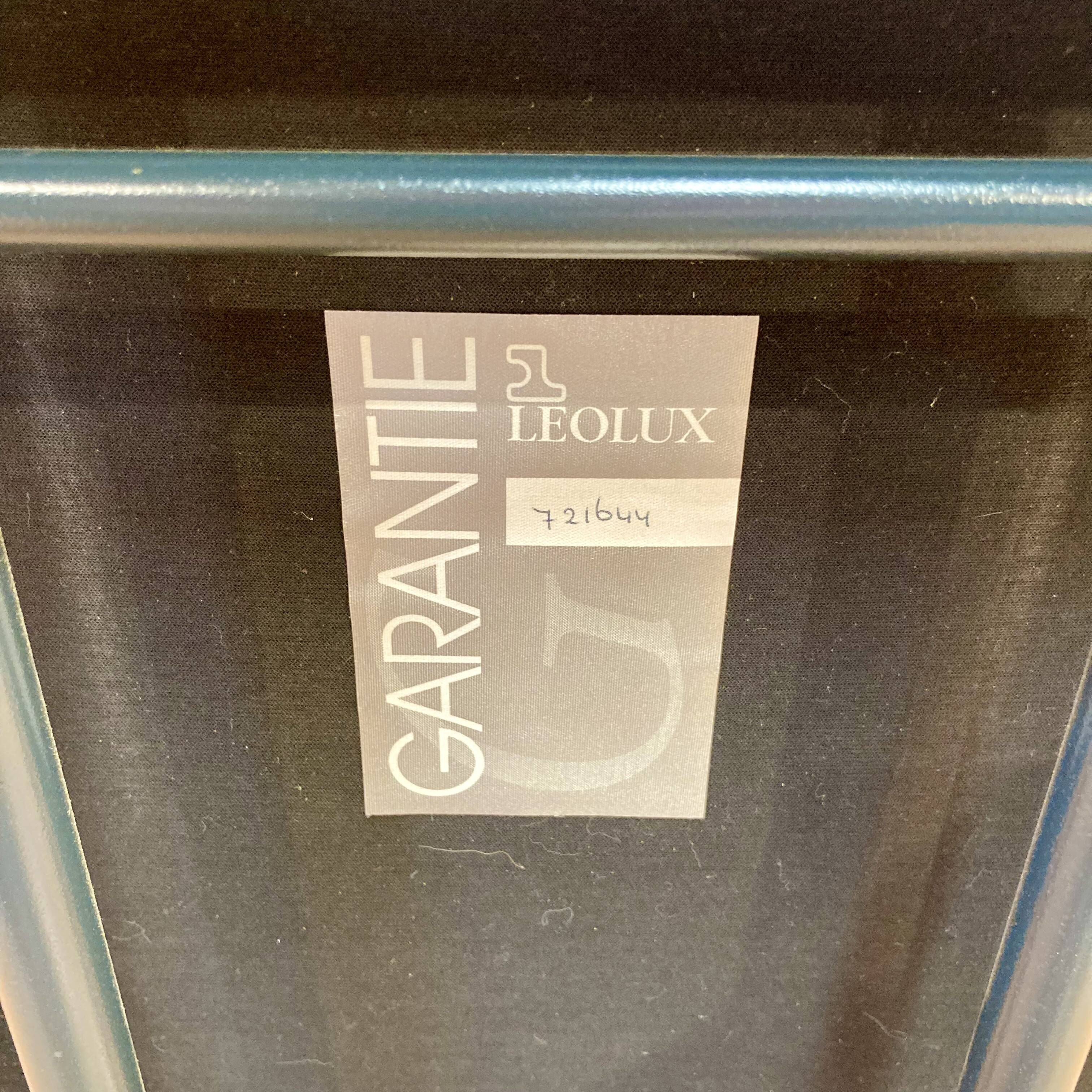 Set of 3 designer leather and metal armchairs.