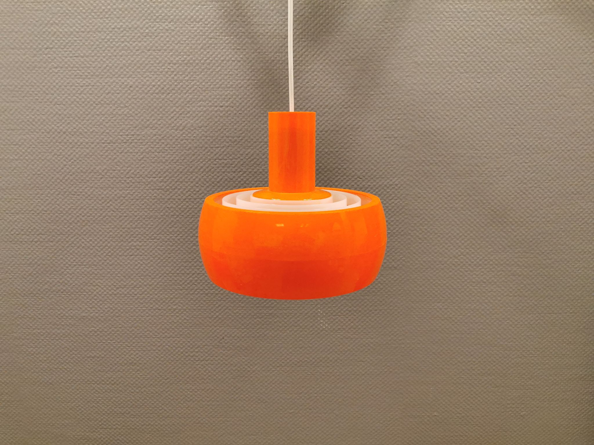 Hanging lamp, designed by Bent Karlby for Schrøder Kemi Denmark 1970s. Made of orange ABS plastic