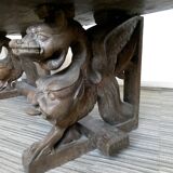 Gothic bench made of solid wood, heads of carved grotesques