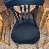 Set of 8 mismatched vintage Baumann Lebrun bistro chairs.
