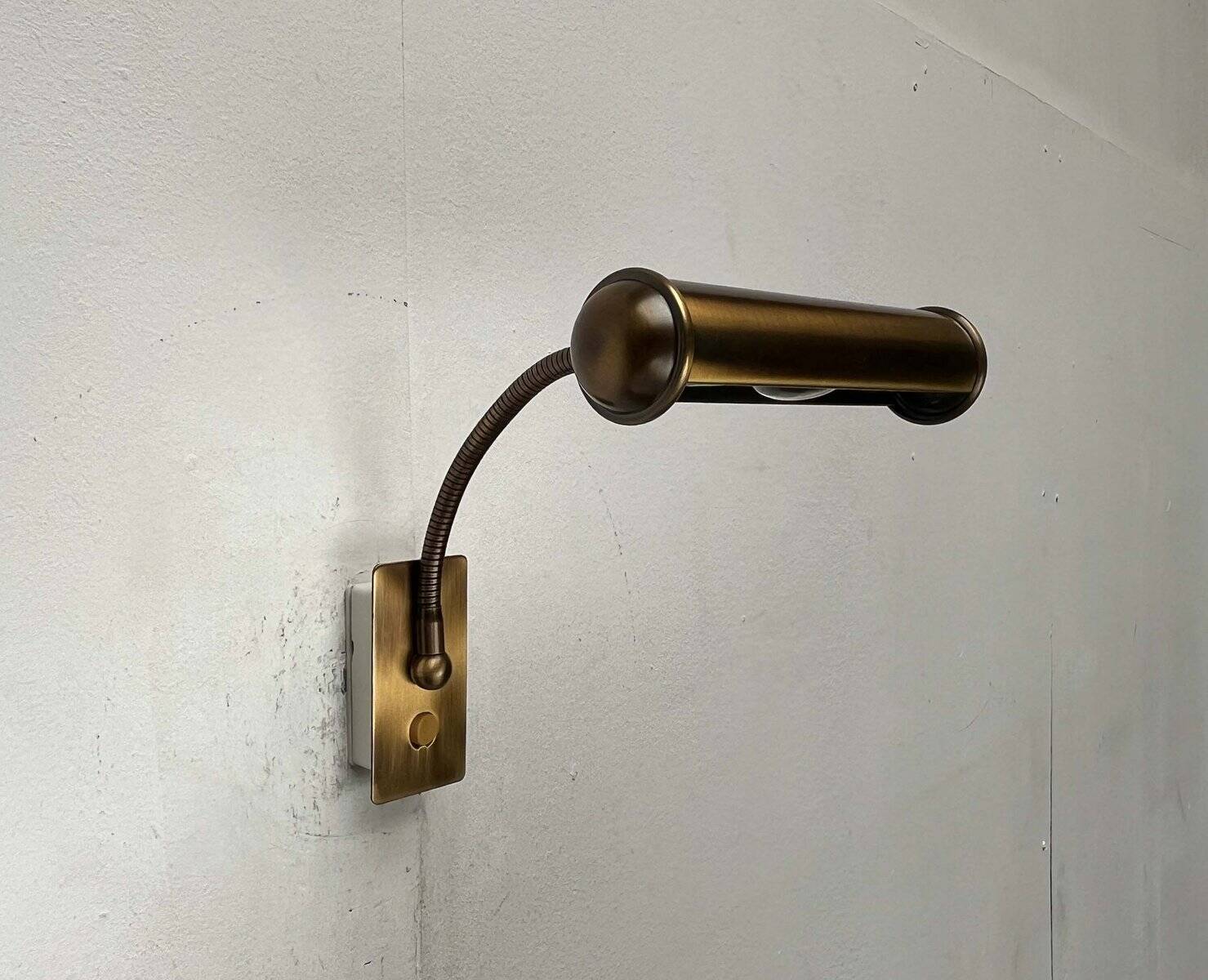 Vintage German brass patinated wall lamp with a gooseneck design by Honsel, 1970s.