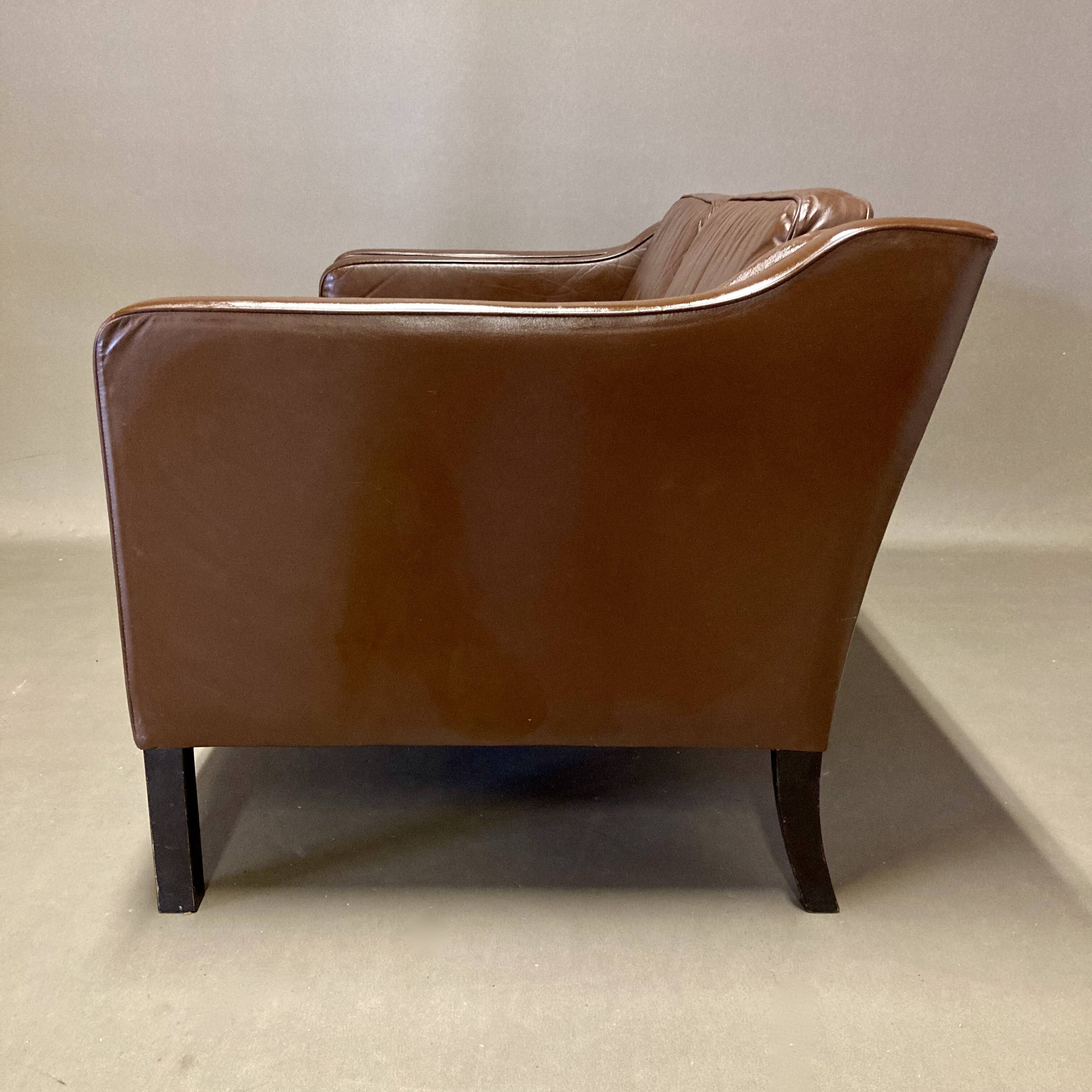 Scandinavian design 2-seater leather sofa.