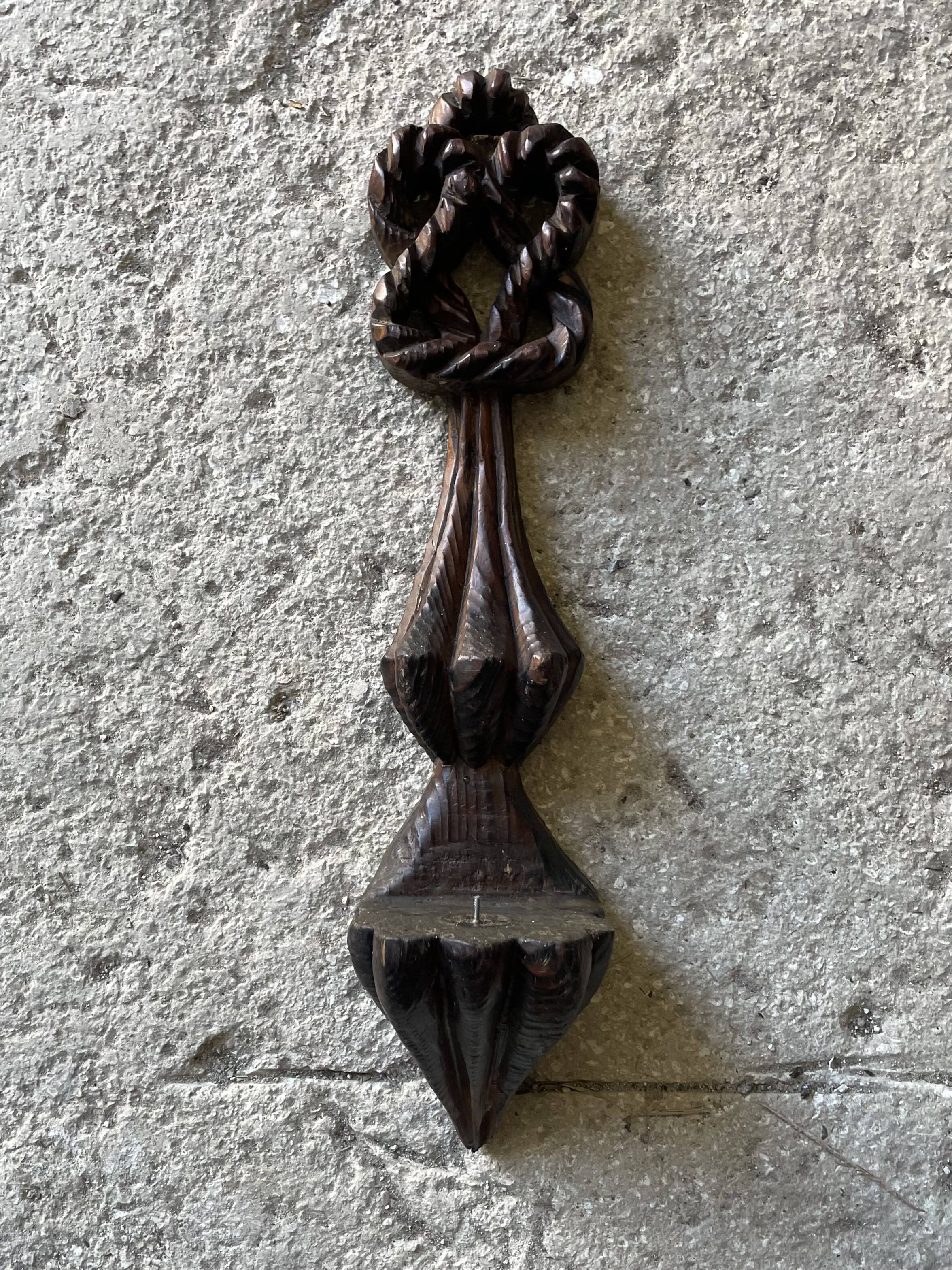 Carved wooden wall candle holder