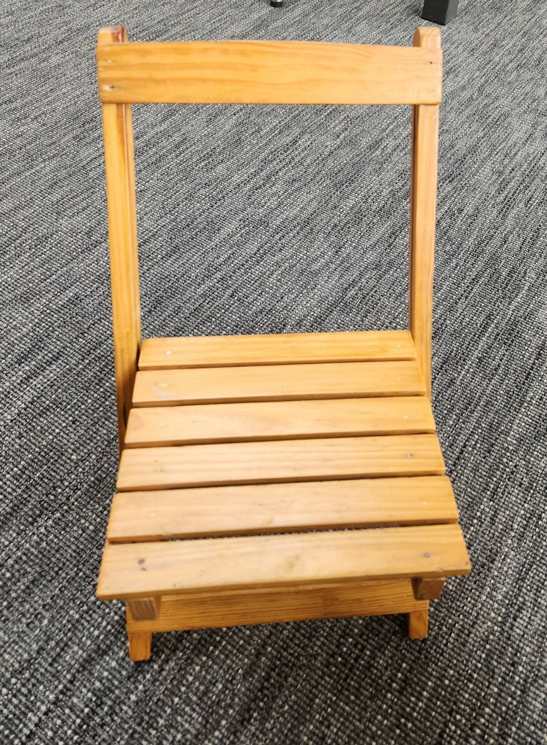 Children's folding chair made of wood.