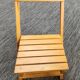 Children's folding chair made of wood.