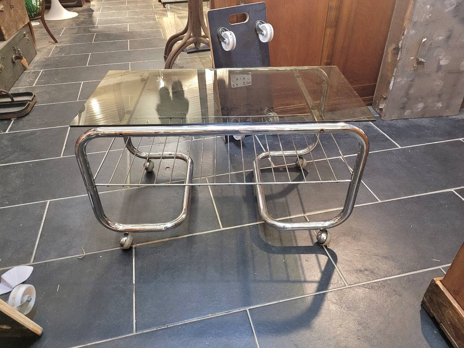 Coffee table with chrome base and smoked glass from the 70s