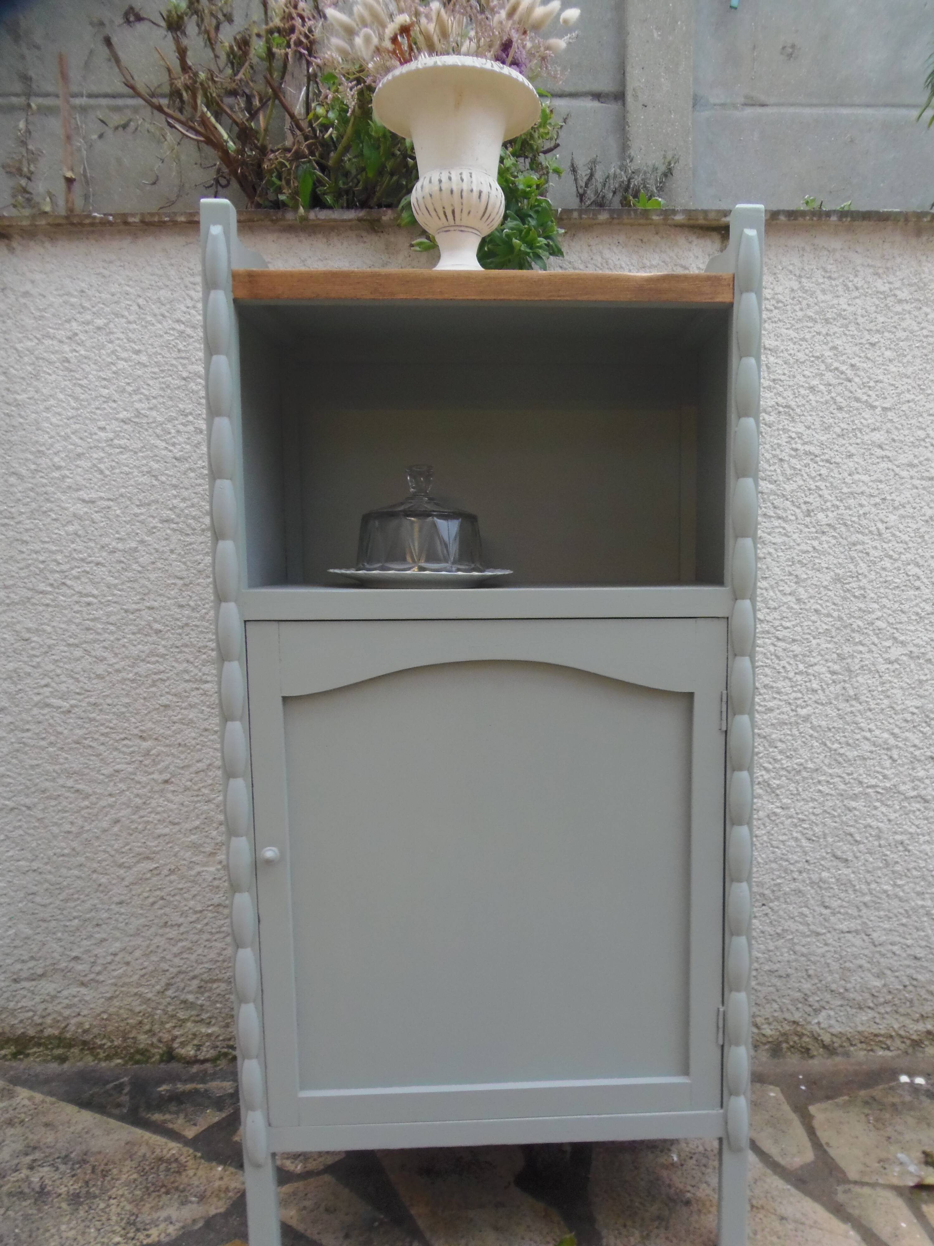 Vintage furniture of shallow depth re-enchanted in grey-green.