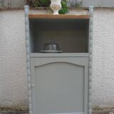 Vintage furniture of shallow depth re-enchanted in grey-green.