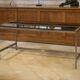 Brushed stainless steel and smoked black glass desk from the 1980s.