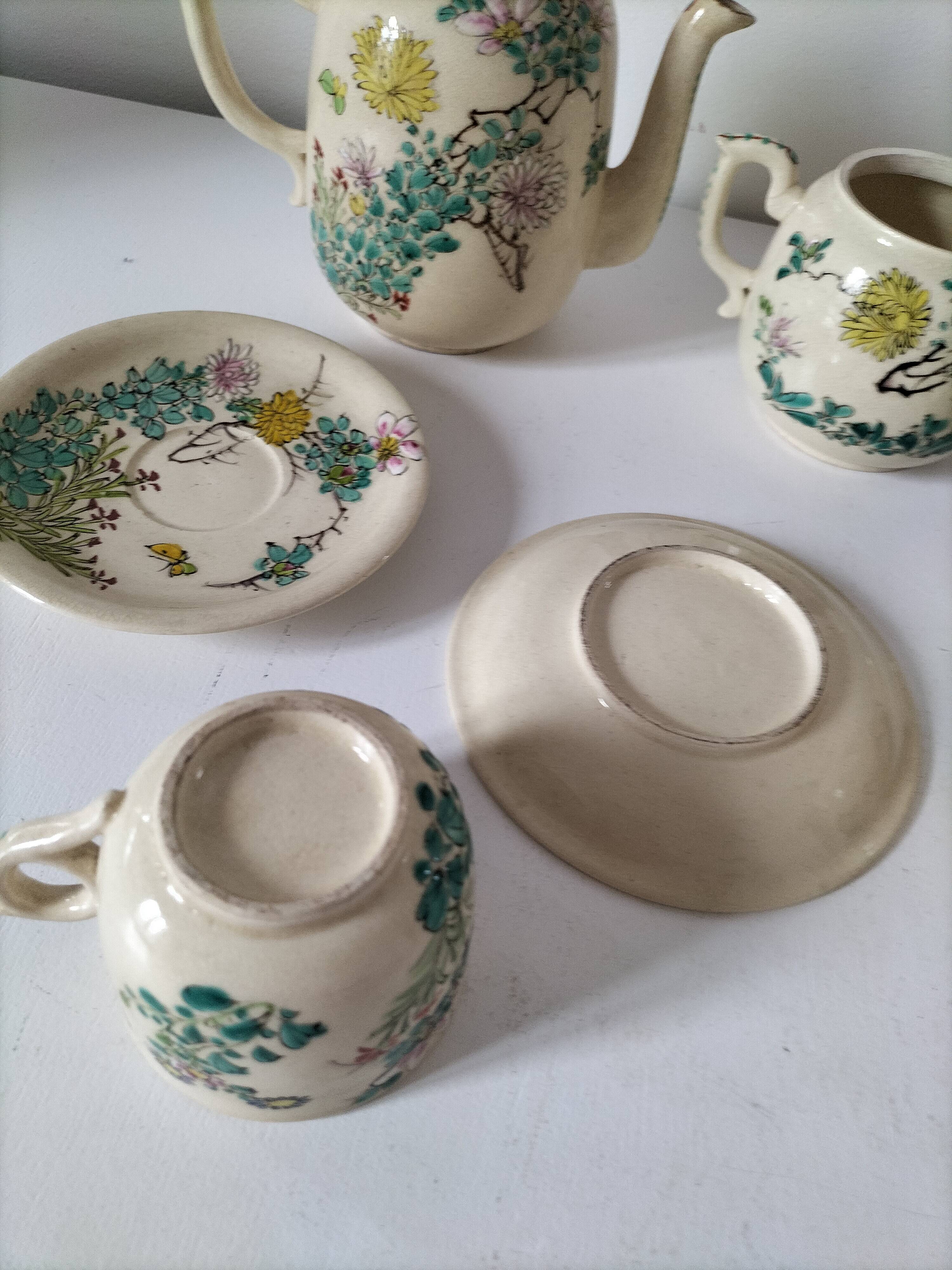 Japanese-style tea set in cracked earthenware with chrysanthemum flowers