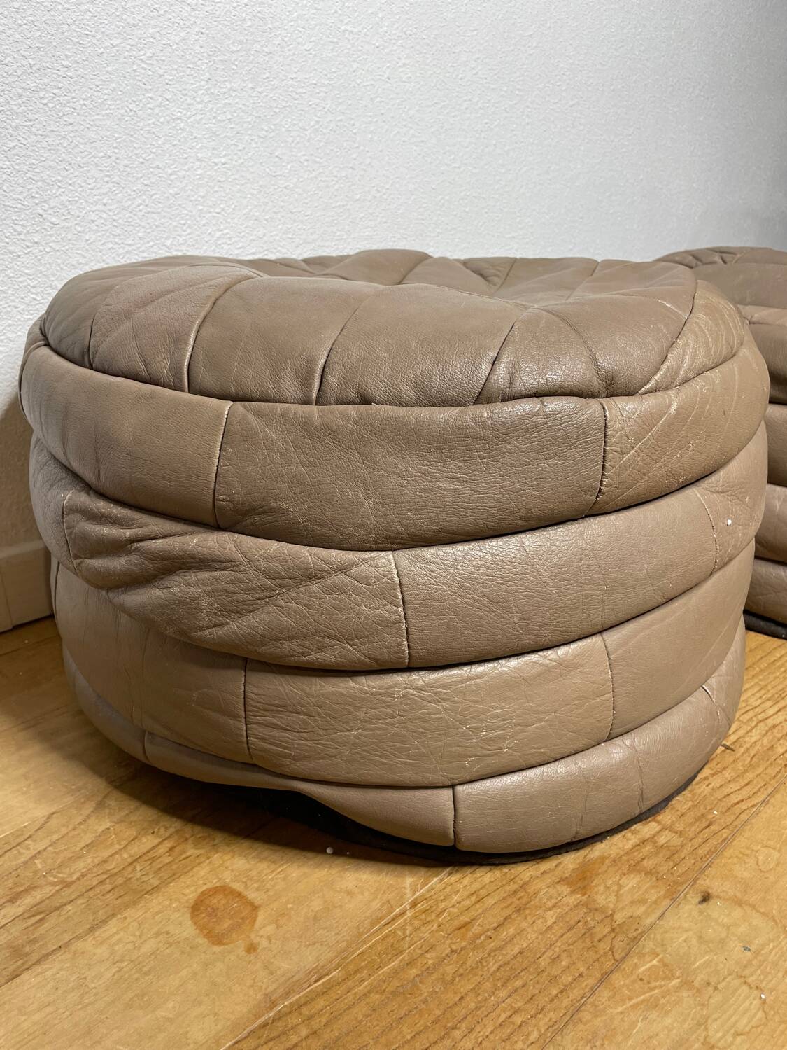 Pair of De Sède patchwork leather poufs