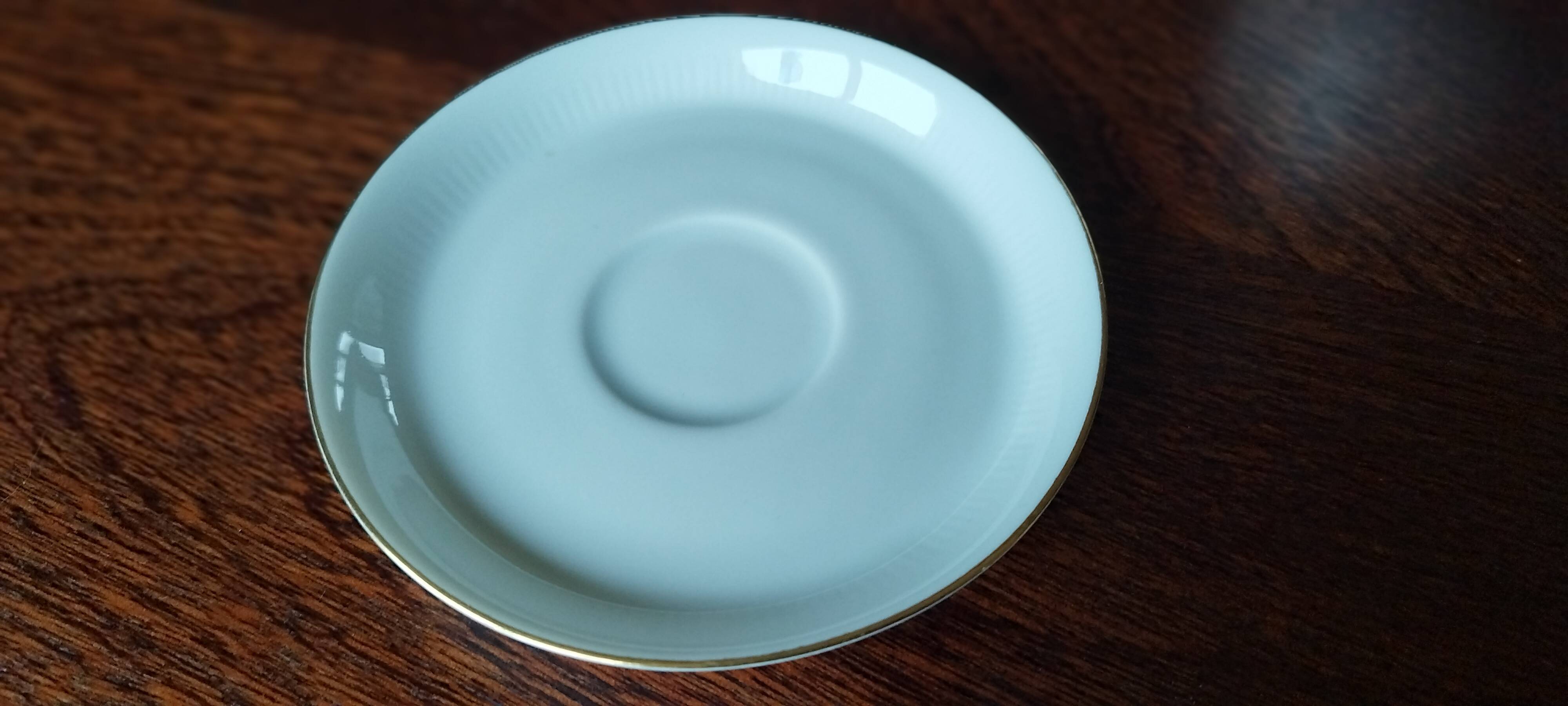 Set of 4 white and gold porcelain cups