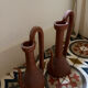 Pair of decorative terracotta jars, in the shape of a ewer.