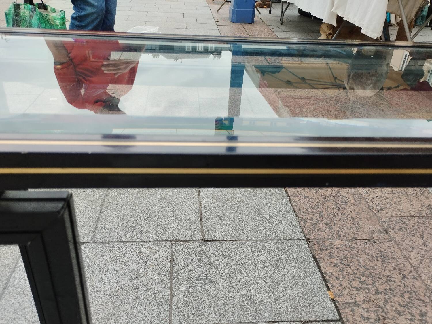 Old console with vintage glass top