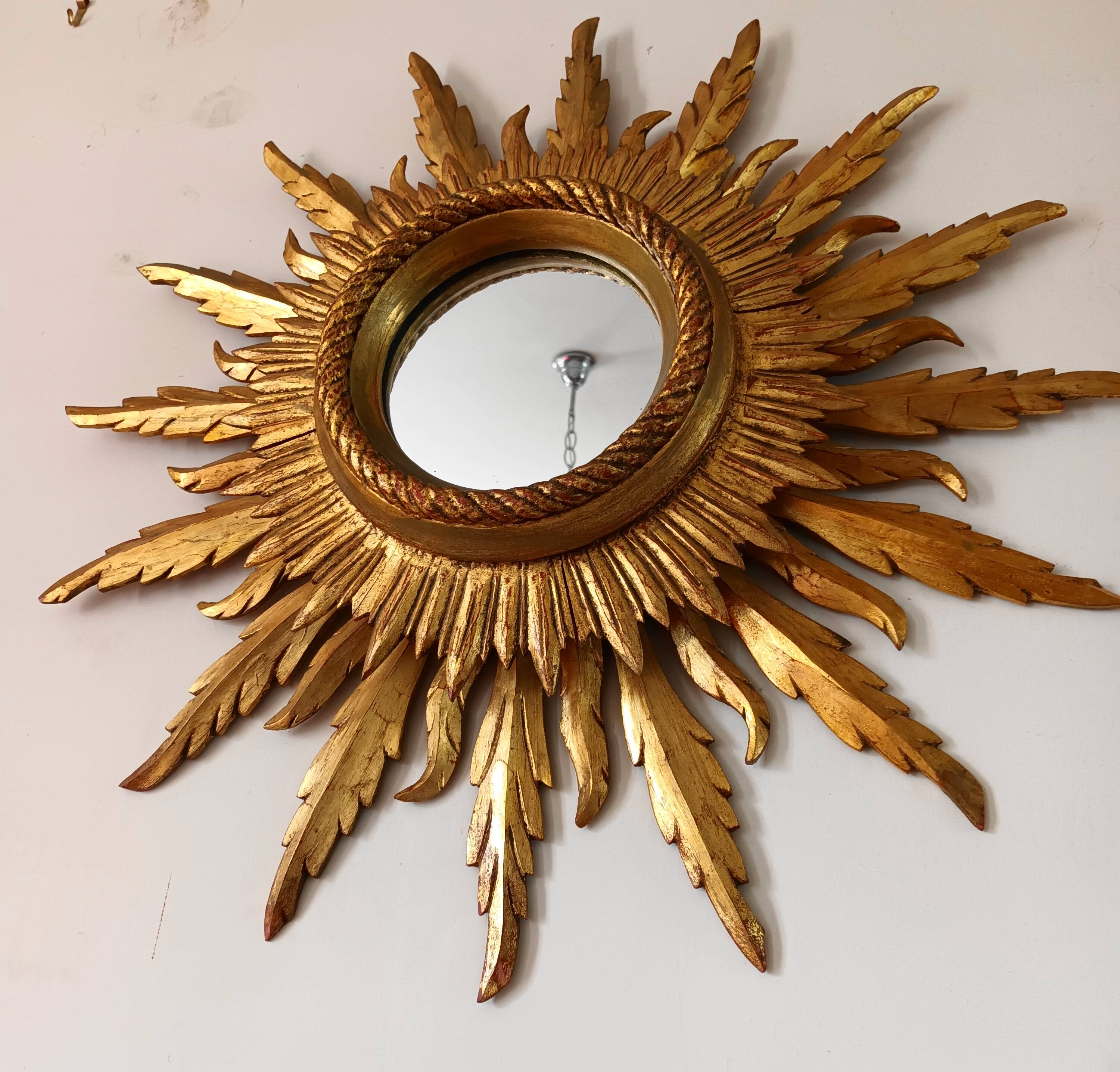 Sun mirror in carved gilded wood from the 1950s