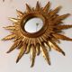 Sun mirror in carved gilded wood from the 1950s