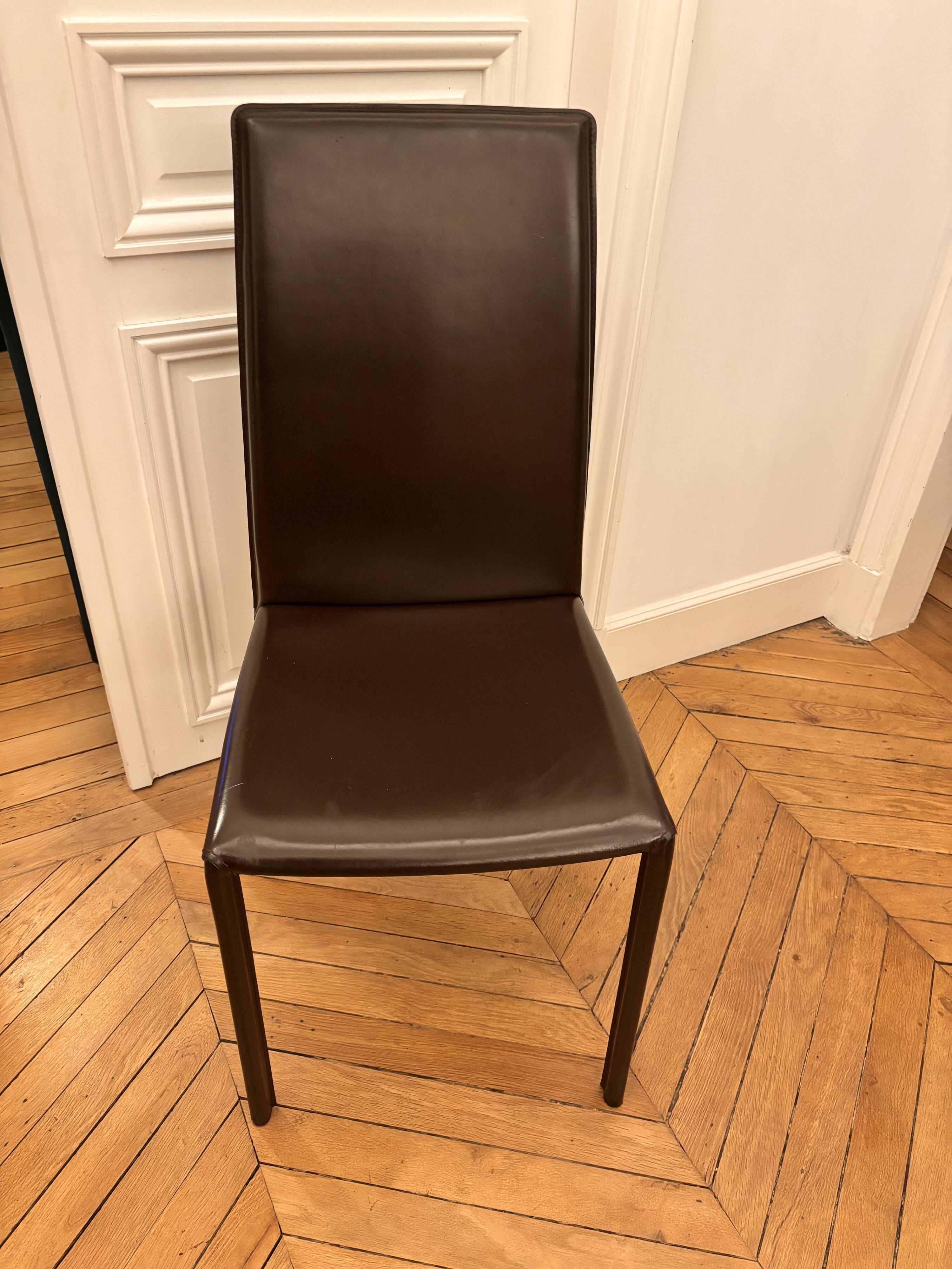 Many brown leather chairs "Roche Bobois"