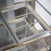 Vintage rolling dessert bar in gold metal and glass by Roche Bobois.