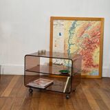 Smoked Plexiglas coffee table on wheels -