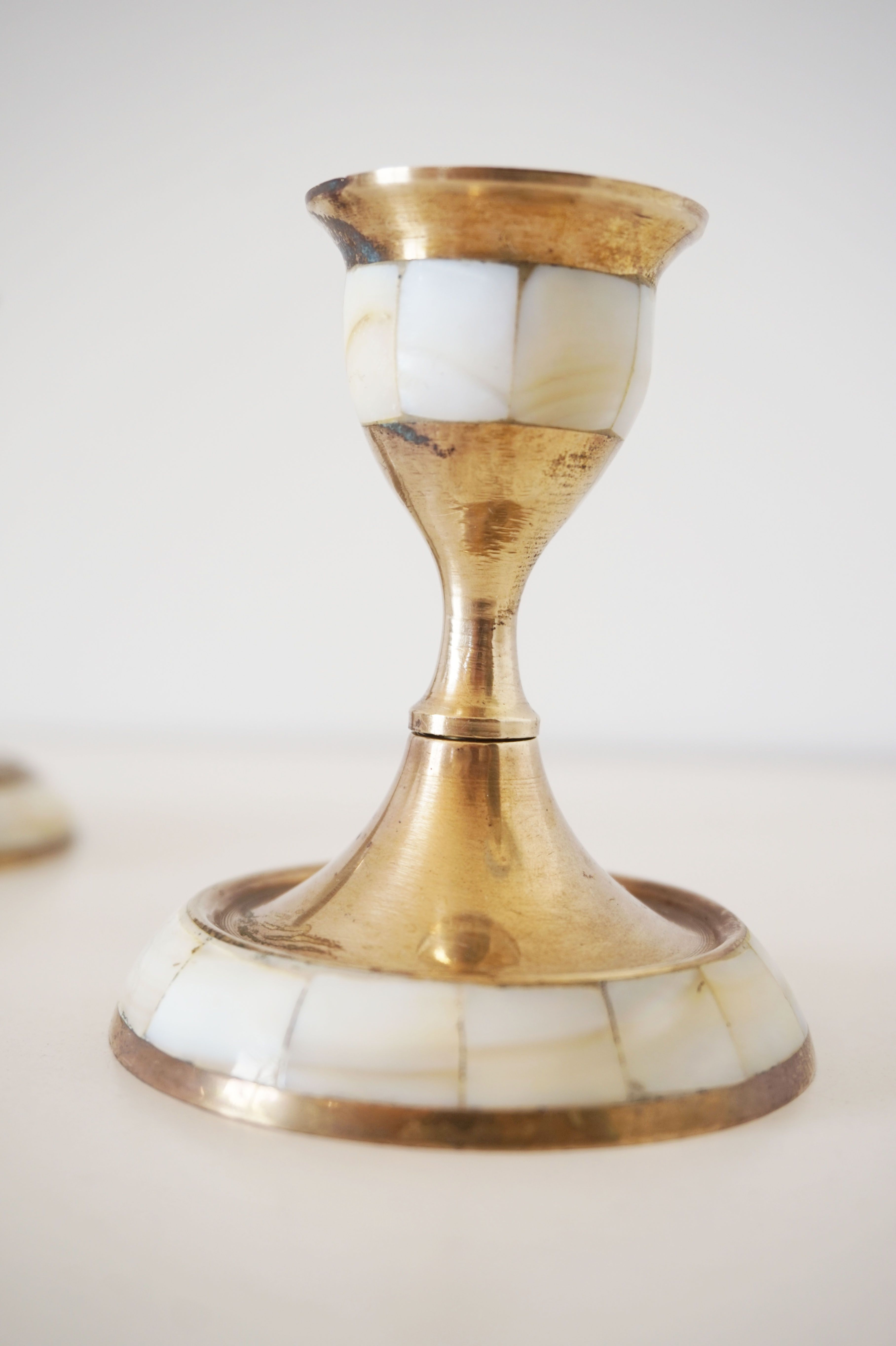 Lot of old candlesticks in brass and mother-of-pearl