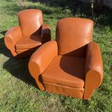 pair of leather clubs