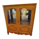 Showcase with shell mouldings in wood, glass, and mirror.