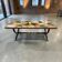 Table basse vintage en pierre avec cadre en fonte